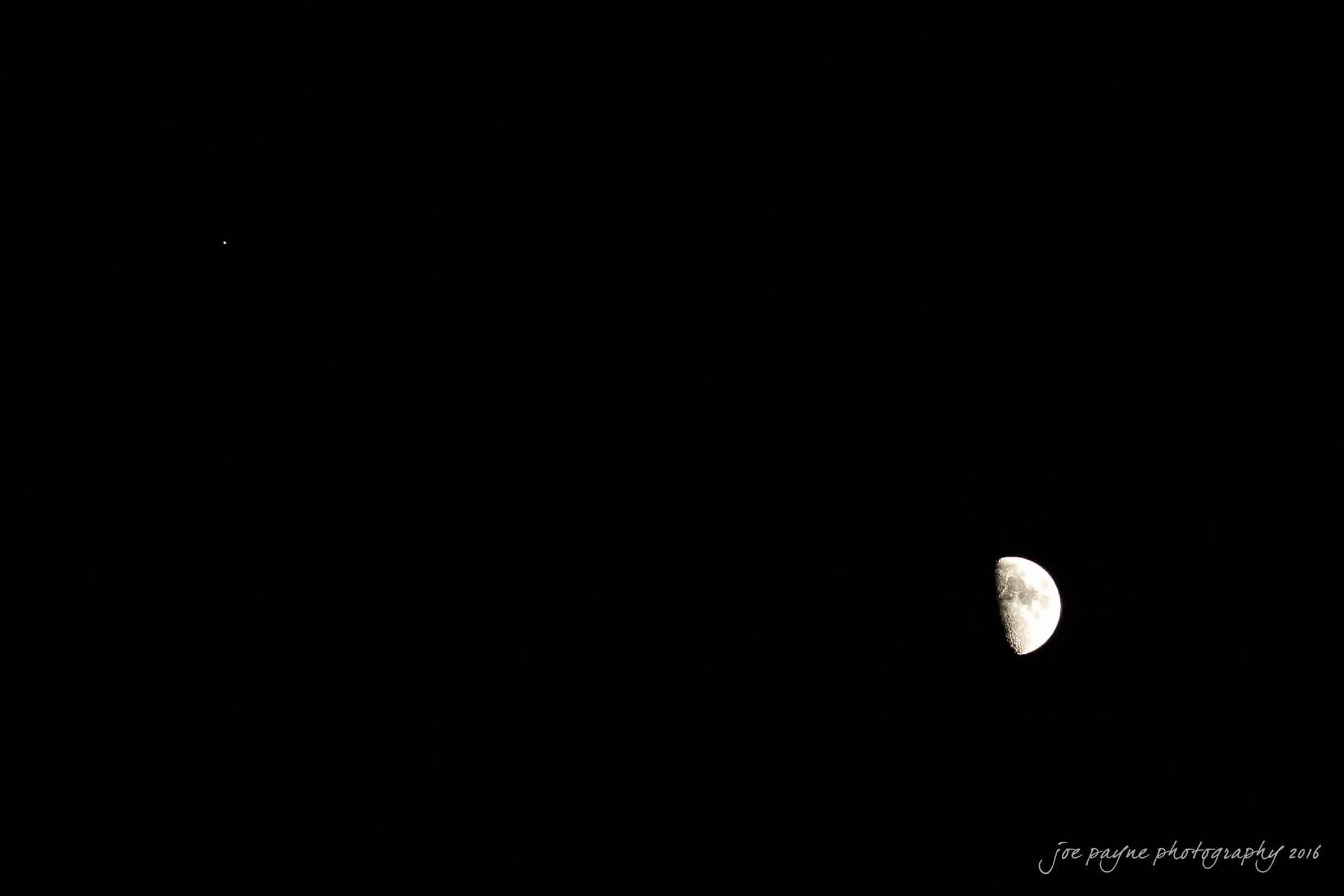 new bern wedding photographer - jessica & brinson A dark night sky with a bright, half-visible moon in the lower right corner and a small, distant star in the upper left. The moon’s surface shows distinct craters and shadowed sections.